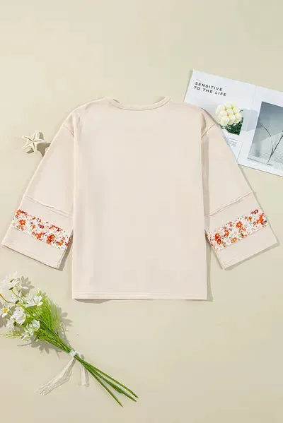 Exposed Seam Slit Floral Round Neck Blouse